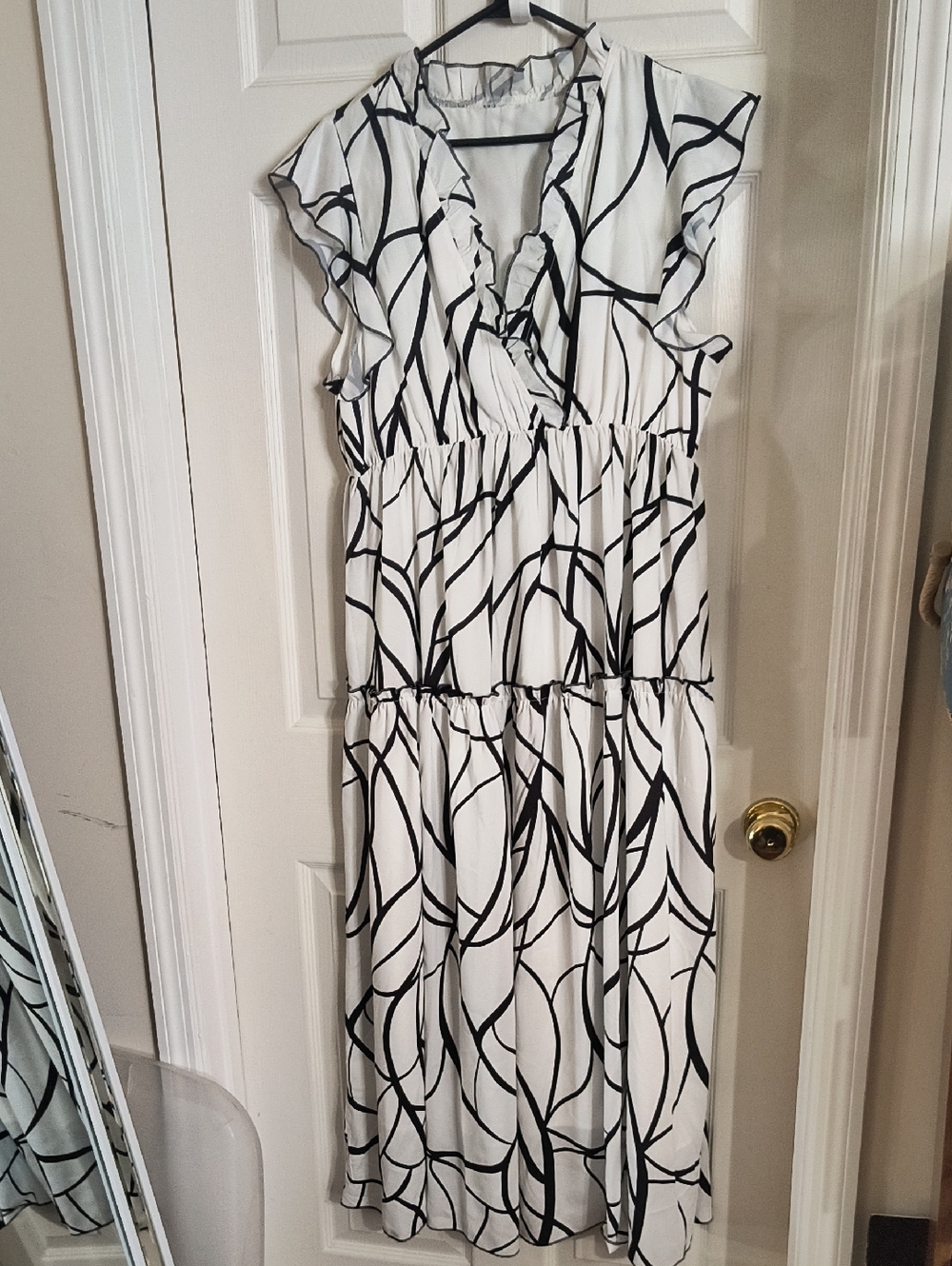 White Maxi Dress with Black Abstract Print and Ruffle V-Neck